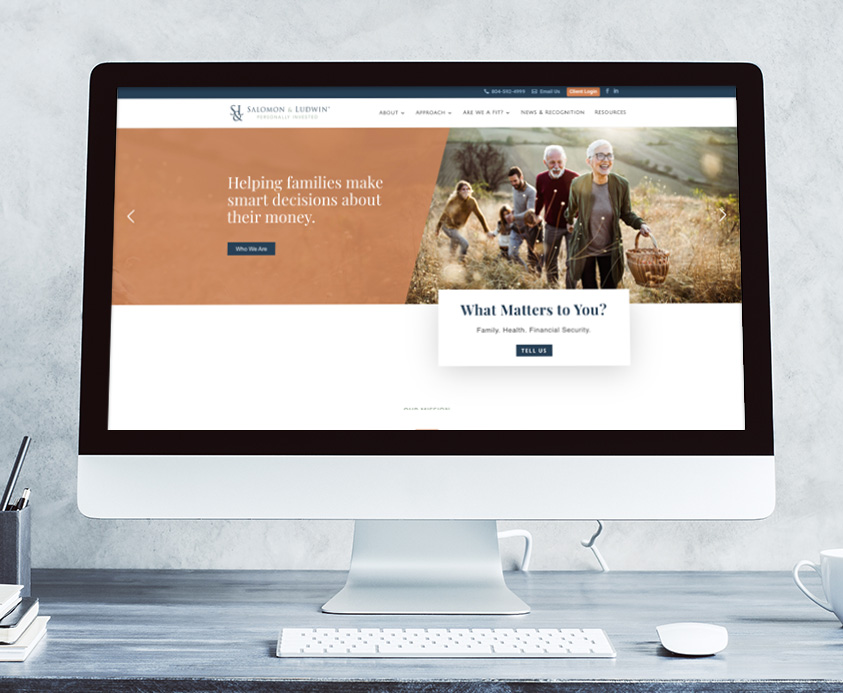 Salomon & Ludwin website design inside computer monitor on a desk