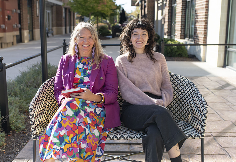 Jolinda Anderson and Jenna Marbukh sitting outside Gather Midlothian